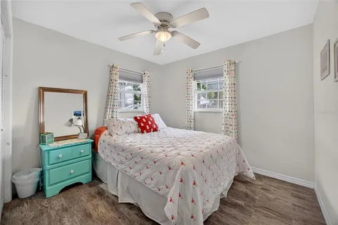 a bedroom with a bed and a dresser
