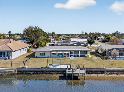 a view of a swimming pool with lounge chair