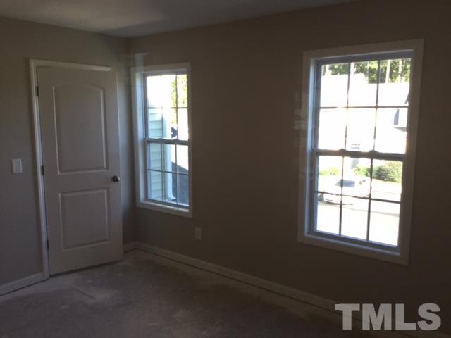 844 Horton Road, Unit 53 Durham, NC 27704 - Photo 6 of 10 an empty room with a window