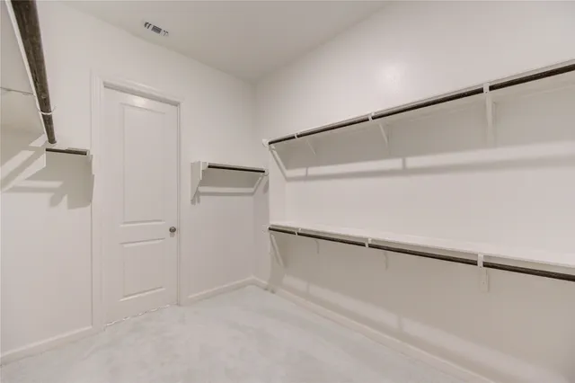 a view of an empty walk in closet