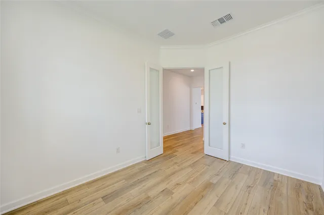 a view of a room with wooden floor