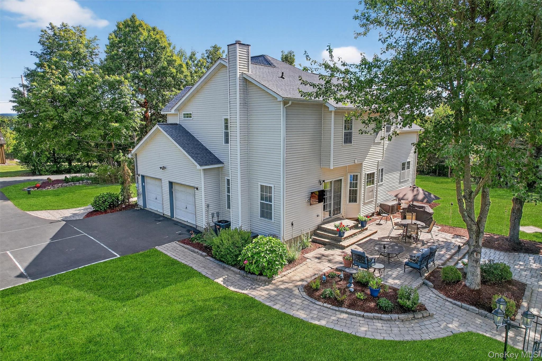 1 Fox Road Florida, NY 10921 - Photo 4 of 48 a front view of a house with a yard garage and outdoor seating