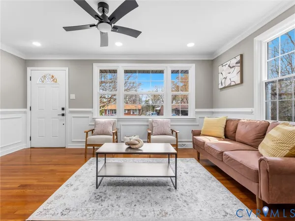 a living room with furniture and a rug