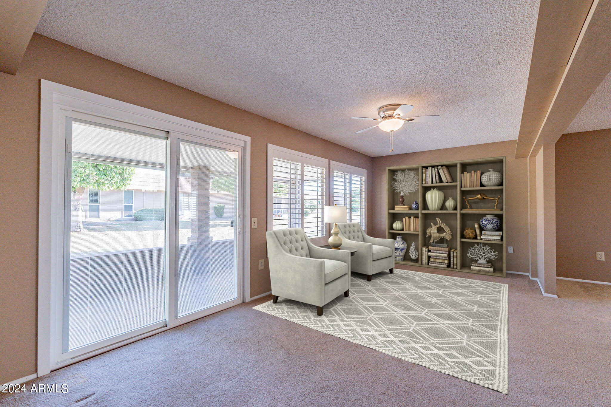 9510 West Greenway Road Sun City, AZ 85351 - Photo 11 of 46 a living room with furniture and large window