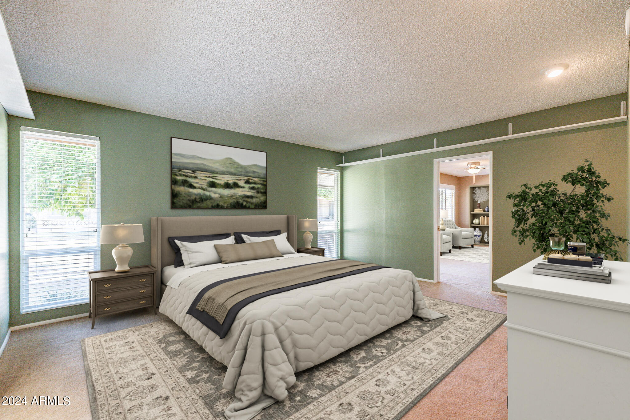 9510 West Greenway Road Sun City, AZ 85351 - Photo 12 of 46 a bedroom with a large bed and a couch