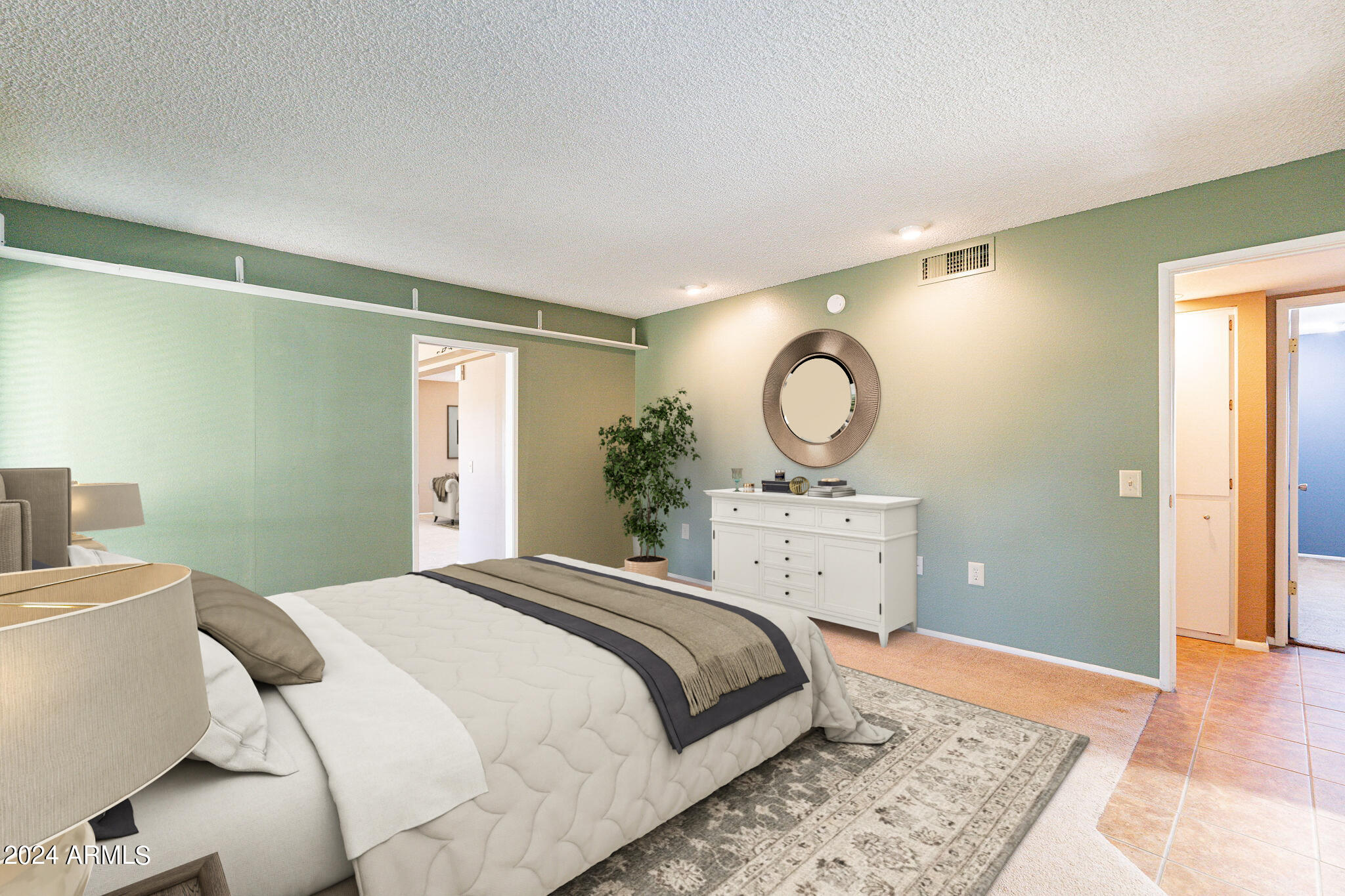 9510 West Greenway Road Sun City, AZ 85351 - Photo 14 of 46 a bedroom with a bed and wooden floor