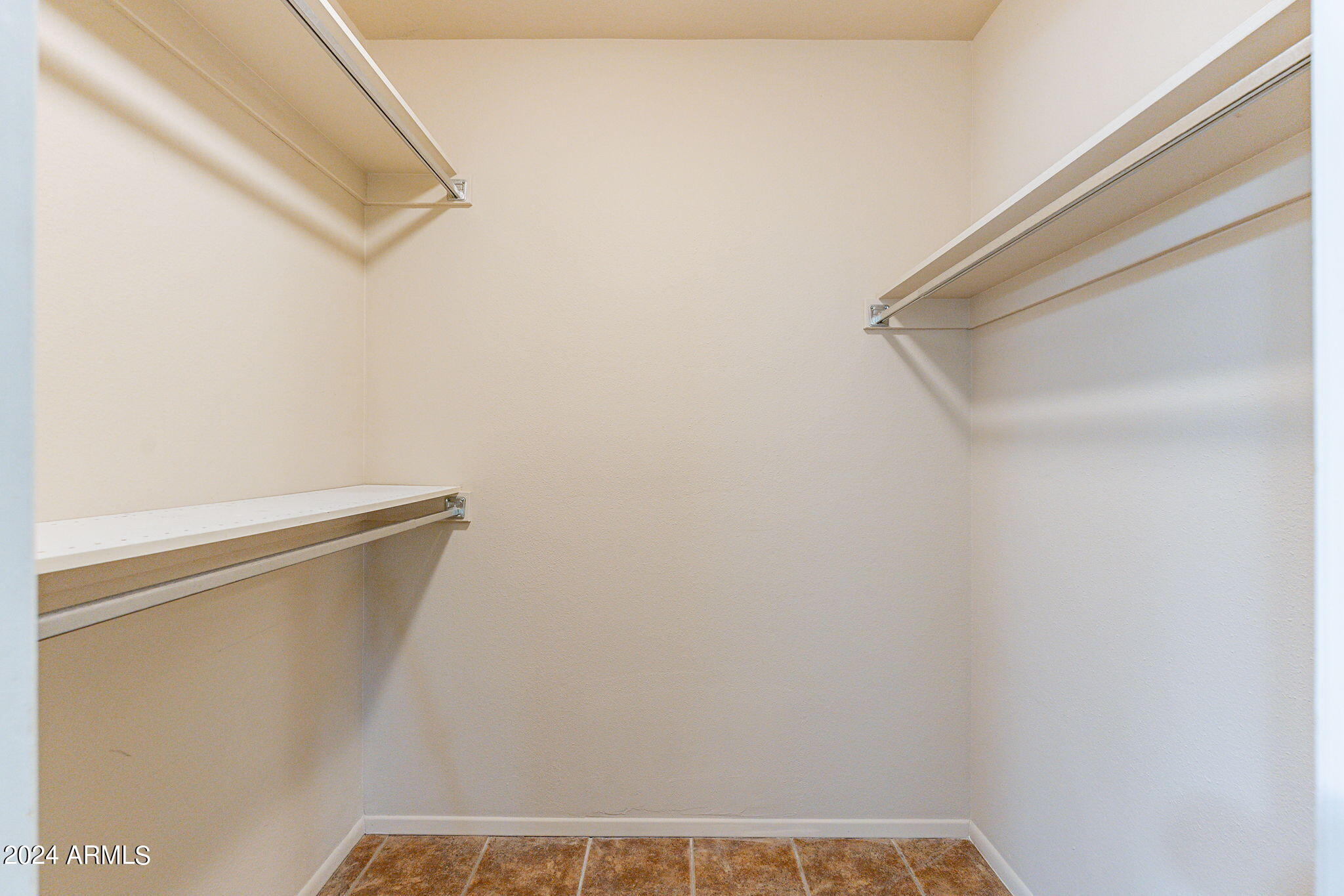 9510 West Greenway Road Sun City, AZ 85351 - Photo 16 of 46 a view of small space with racks on the wall