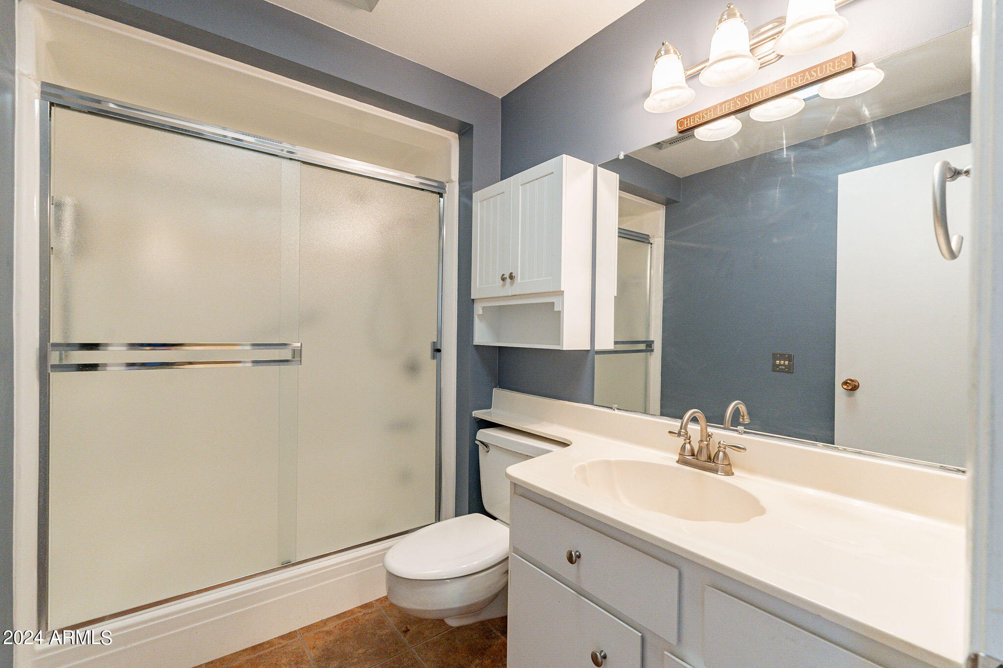 9510 West Greenway Road Sun City, AZ 85351 - Photo 21 of 46 a bathroom with a sink toilet and shower