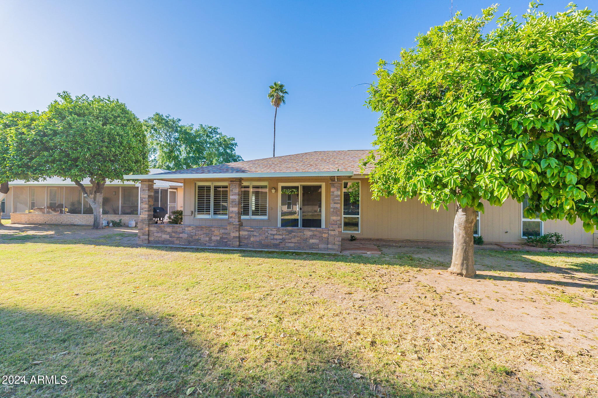 9510 West Greenway Road Sun City, AZ 85351 - Photo 28 of 46 a front view of a house with swimming pool