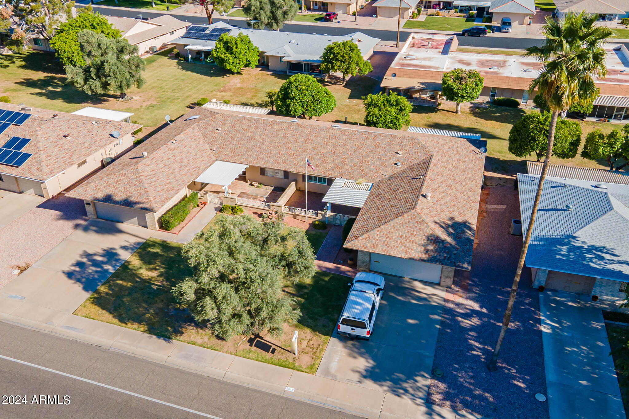 9510 West Greenway Road Sun City, AZ 85351 - Photo 31 of 46 an aerial view of a house with a yard basket ball court and a street view