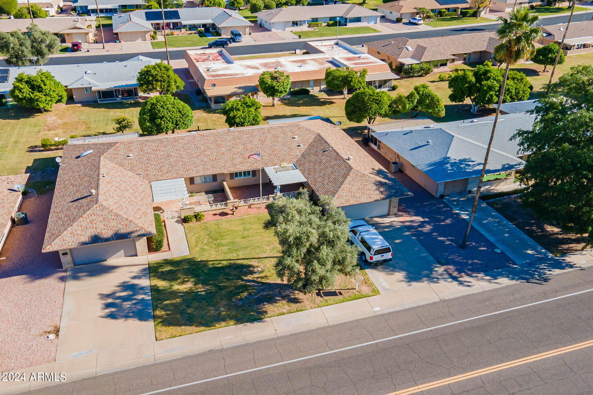 9510 West Greenway Road Sun City, AZ 85351 - Photo 32 of 46 an aerial view of a house with garden space and street view