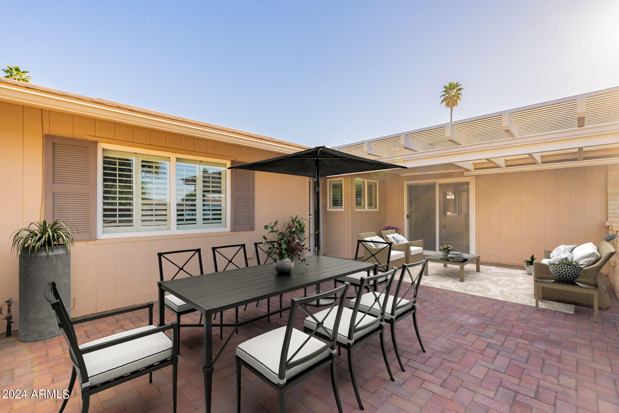 9510 West Greenway Road Sun City, AZ 85351 - Photo 4 of 46 a view of a house with patio and a yard
