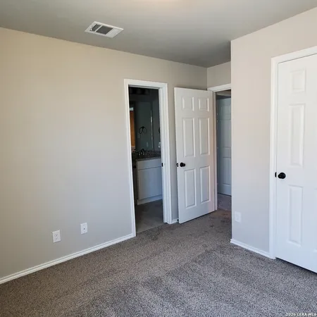 an empty room with closet area