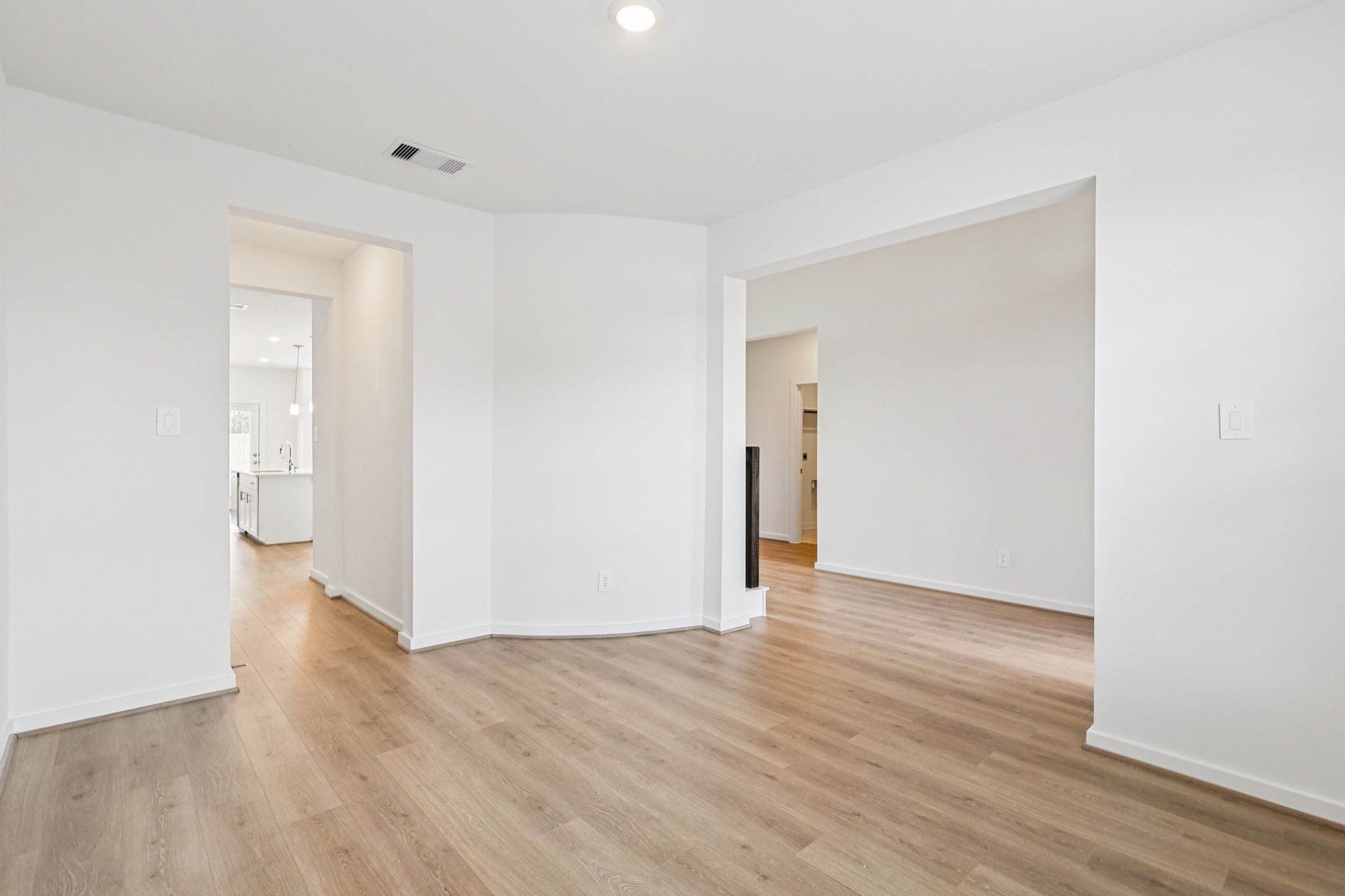 5815 Chamberlain Crossing Rosenberg, TX 77471 - Photo 11 of 35 a view of an empty room with wooden floor