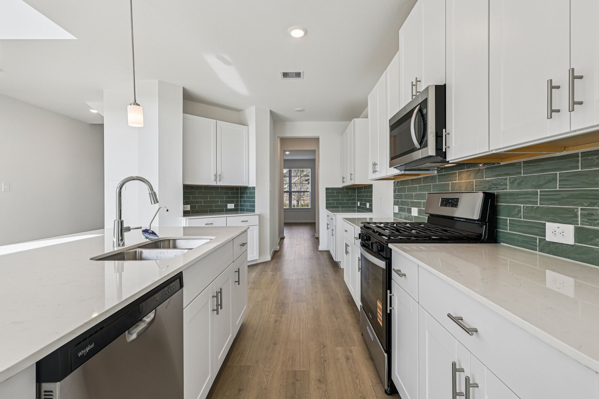 5815 Chamberlain Crossing Rosenberg, TX 77471 - Photo 4 of 35 a kitchen with stainless steel appliances granite countertop a sink stove and refrigerator