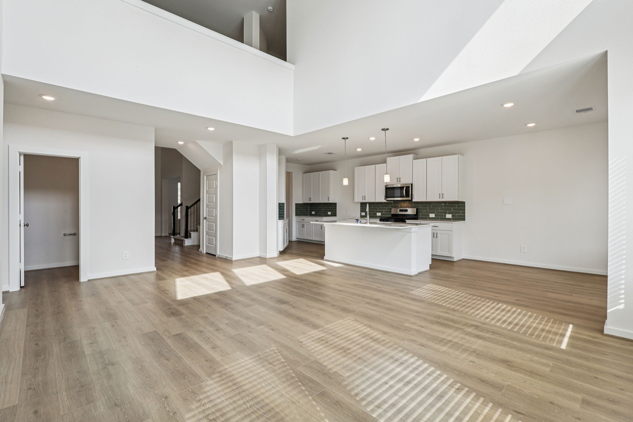 5815 Chamberlain Crossing Rosenberg, TX 77471 - Photo 5 of 35 a view of a kitchen with a sink and cabinets