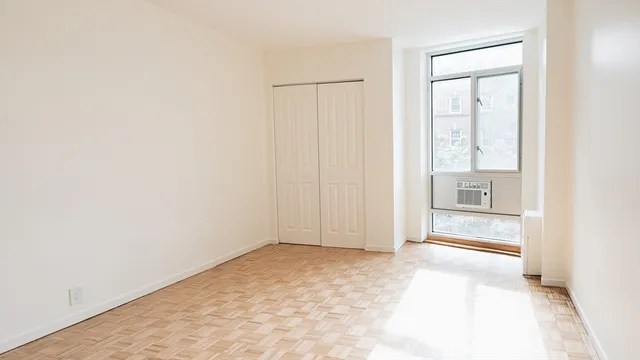 a view of an empty room and window