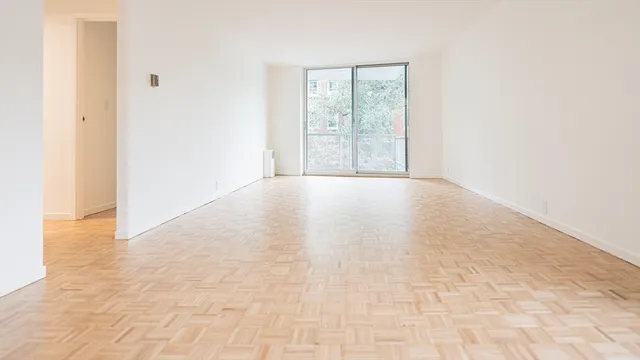 a view of an empty room with a window