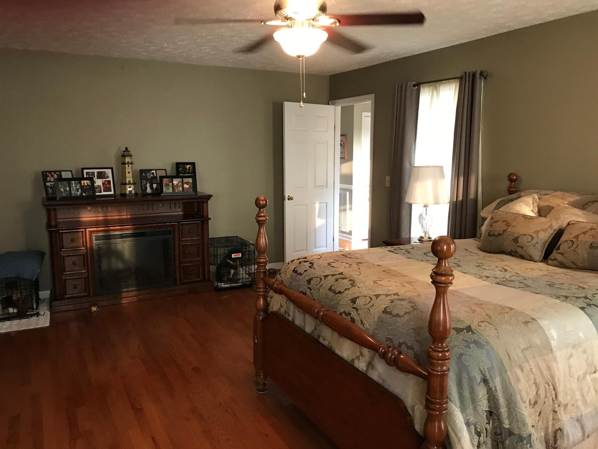 176 Meadows Road Portland, TN 37148 - Photo 8 of 22 a bed sitting in a bedroom next to a window