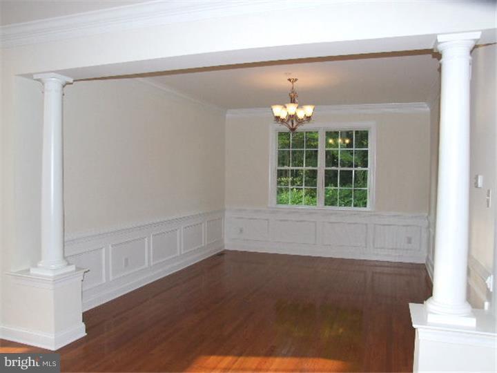 117 North Hillcrest Road Springfield, PA 19064 - Photo 4 of 17 a view of an empty room with wooden floor and a window