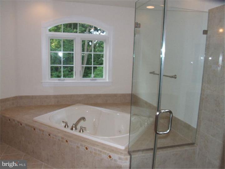 117 North Hillcrest Road Springfield, PA 19064 - Photo 10 of 17 a bath tub sitting next to a window