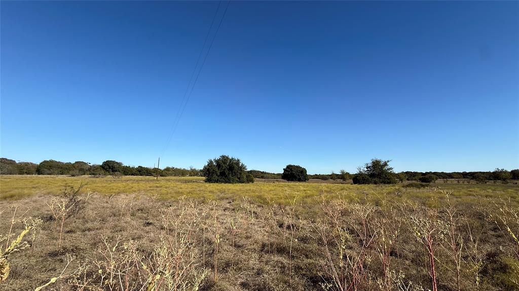 1383 County Road 1110 Meridian, TX 76665 - Photo 15 of 16 a view of a lake and mountain in the background