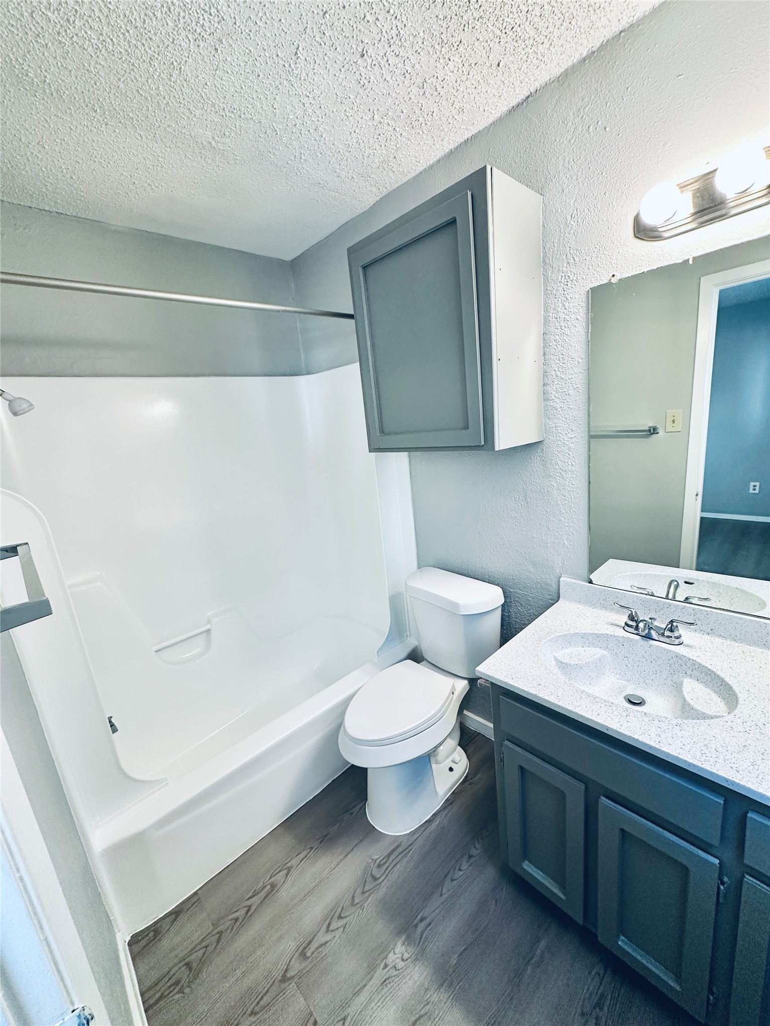 3702 South 2nd Street, Unit 103 Austin, TX 78704 - Photo 12 of 12 a bathroom with a sink a toilet and shower