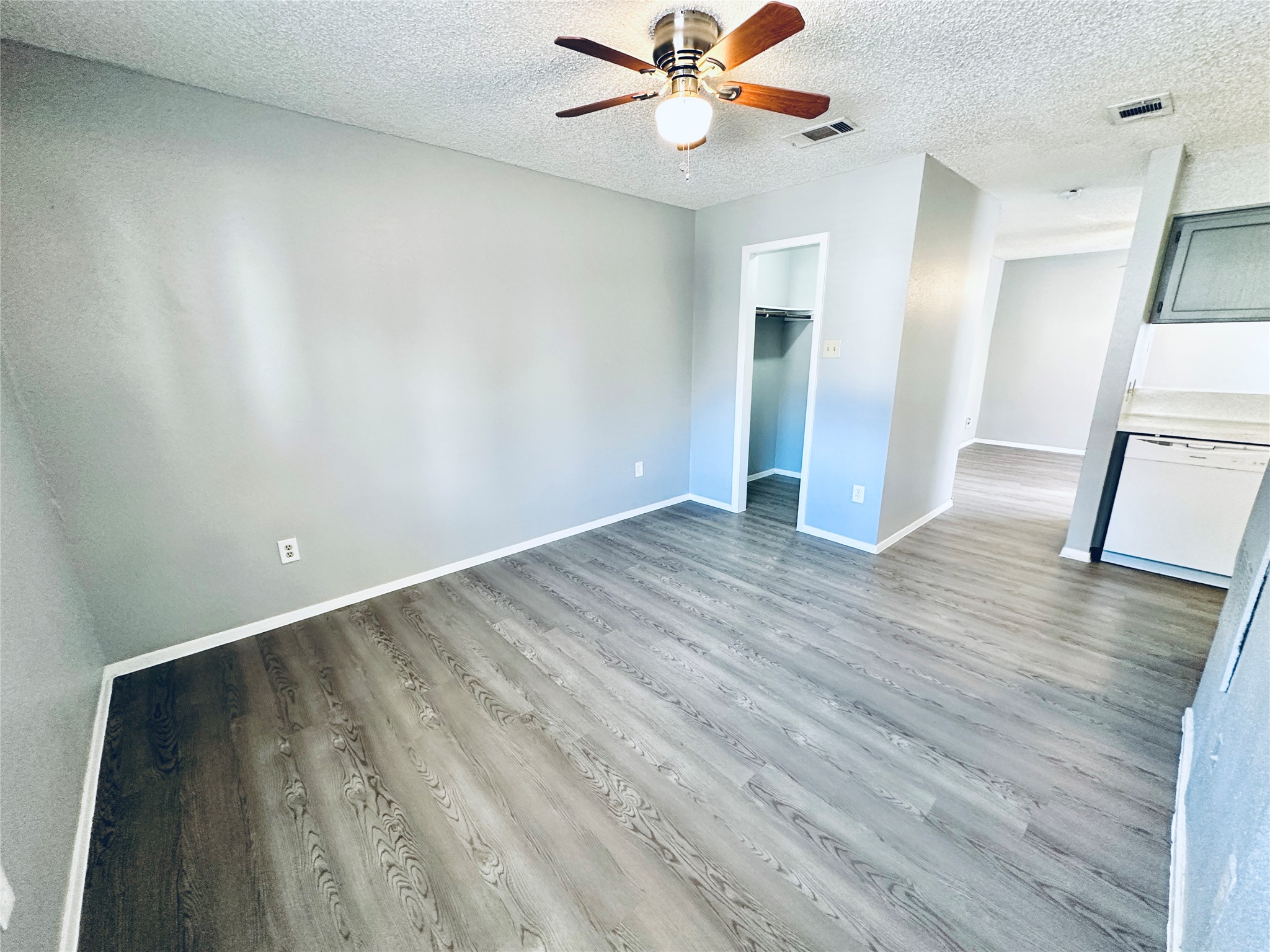 3702 South 2nd Street, Unit 103 Austin, TX 78704 - Photo 10 of 12 wooden floor in an empty room with a window