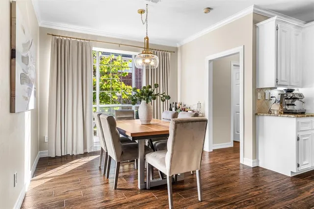 a dining room with furniture window wooden floor