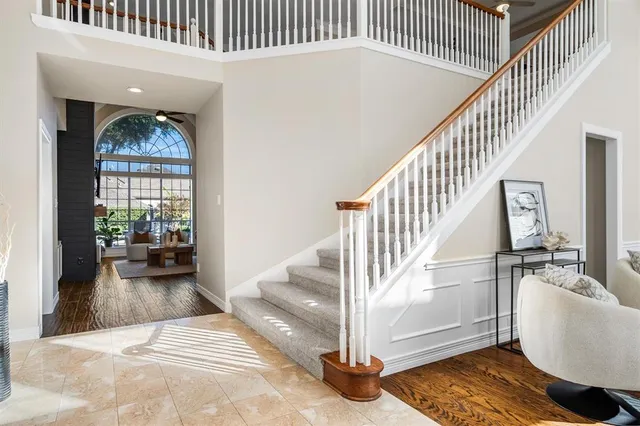 a view of entryway and hall with wooden floor