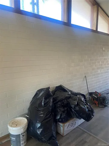 a bathroom with a black and white toilet