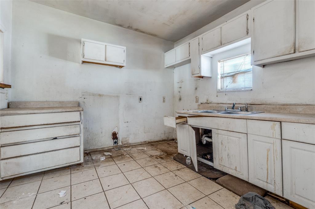3914 Spence Street Dallas, TX 75215 - Photo 13 of 14 a room with storage and utility