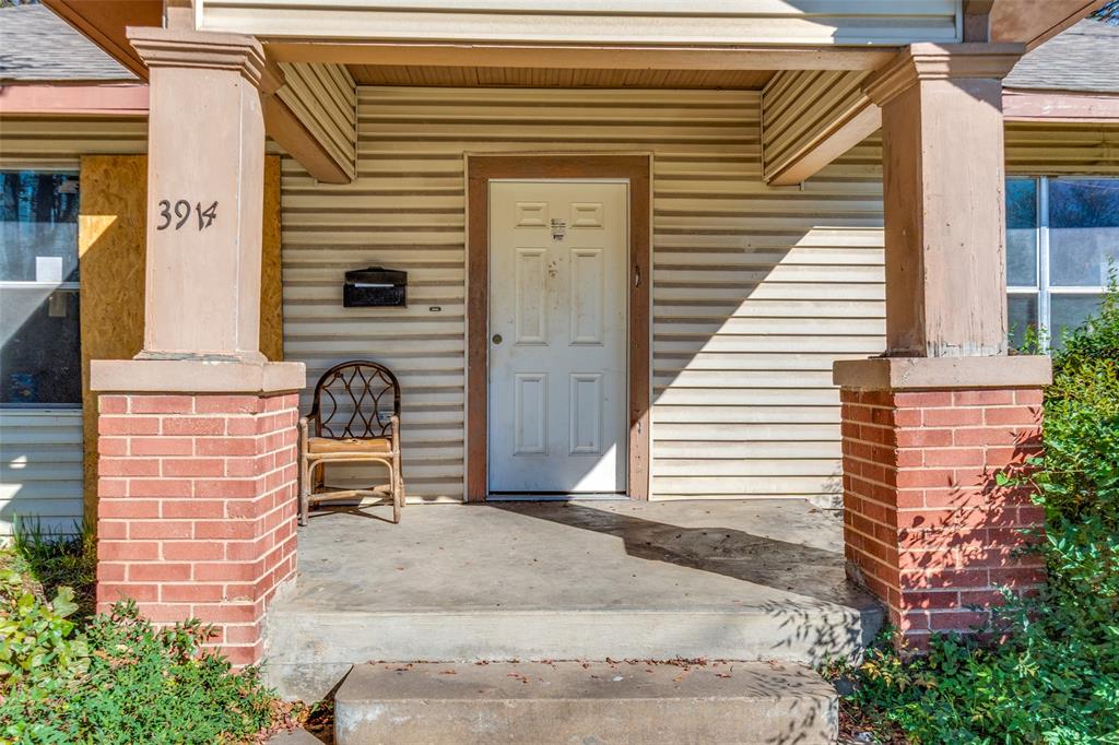 3914 Spence Street Dallas, TX 75215 - Photo 3 of 14 a front view of a house with a garden