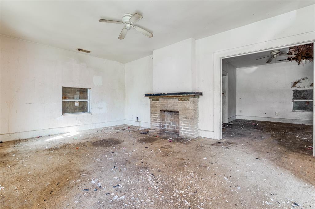3914 Spence Street Dallas, TX 75215 - Photo 4 of 14 a view of empty room with a fireplace