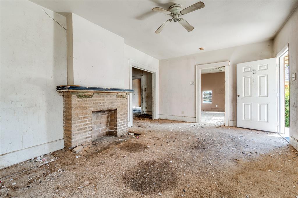 3914 Spence Street Dallas, TX 75215 - Photo 5 of 14 a view of a livingroom with a fireplace
