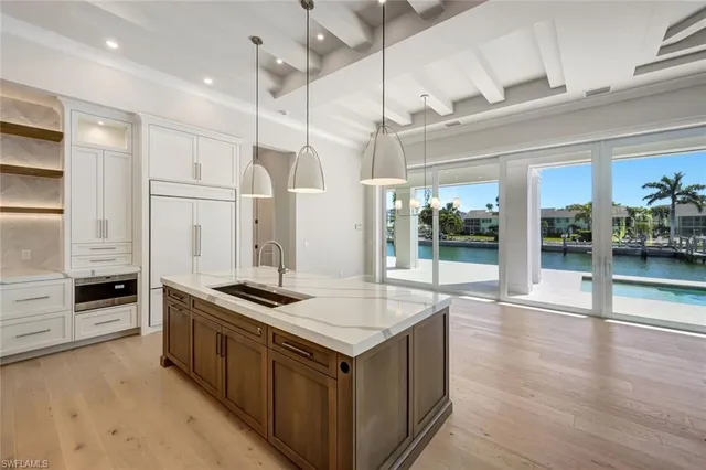a kitchen with stainless steel appliances granite countertop a stove and a refrigerator