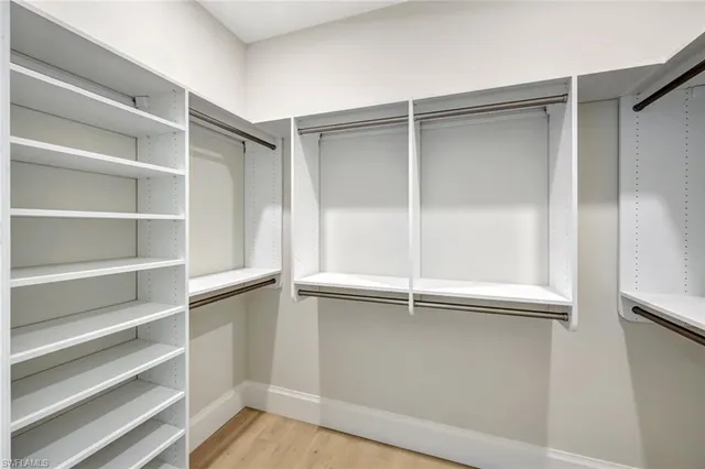 a view of an empty walk in closet