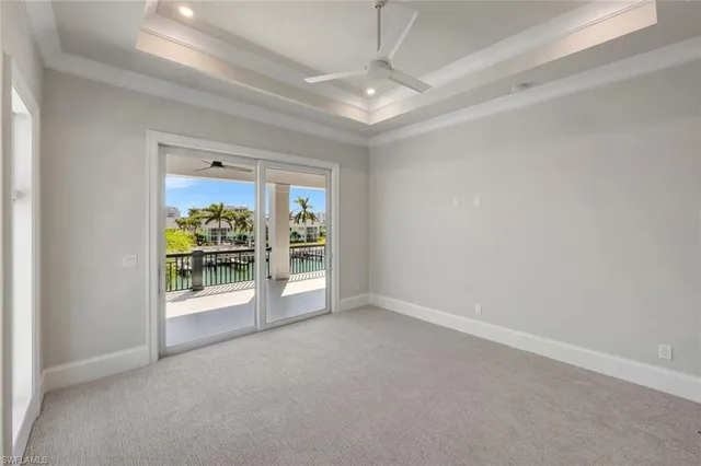 an empty room with furniture and natural light