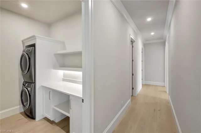 a utility room with sink dryer and washer