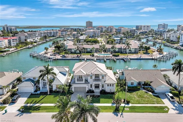an aerial view of a house with a lake view