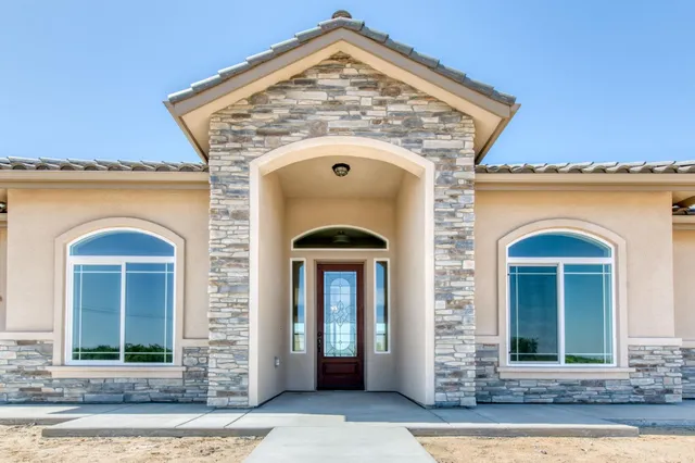 a view of a stone house with a door