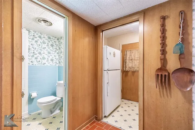 a bathroom with a shower toilet and a sink