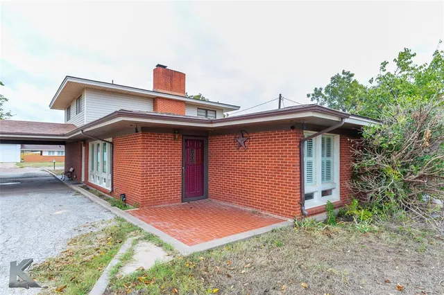 a front view of a house with yard