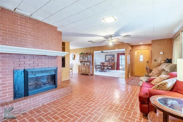 a view of a livingroom with furniture and a fireplace