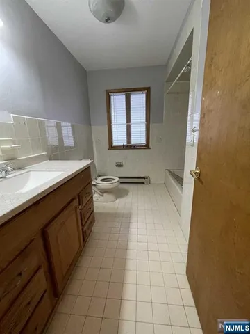 a bathroom with a sink a mirror and a bathtub