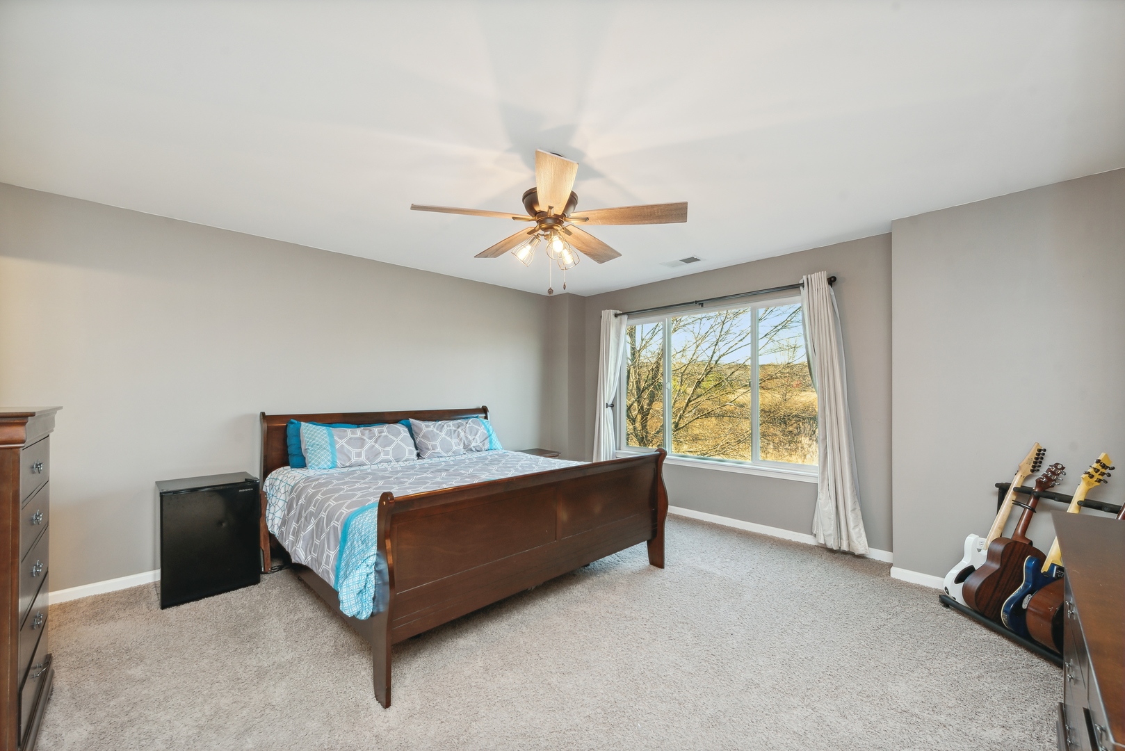 1355 Draper Road McHenry, IL 60050 - Photo 11 of 18 a bed room with a bed and a ceiling fan