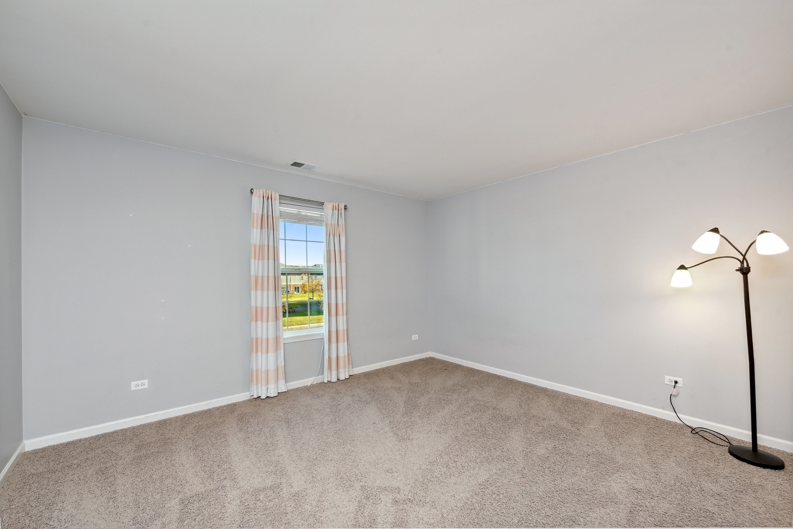 1355 Draper Road McHenry, IL 60050 - Photo 13 of 18 a view of an empty room with a window