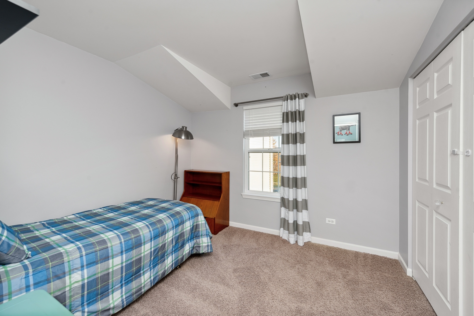 1355 Draper Road McHenry, IL 60050 - Photo 14 of 18 a bedroom with a bed and a window
