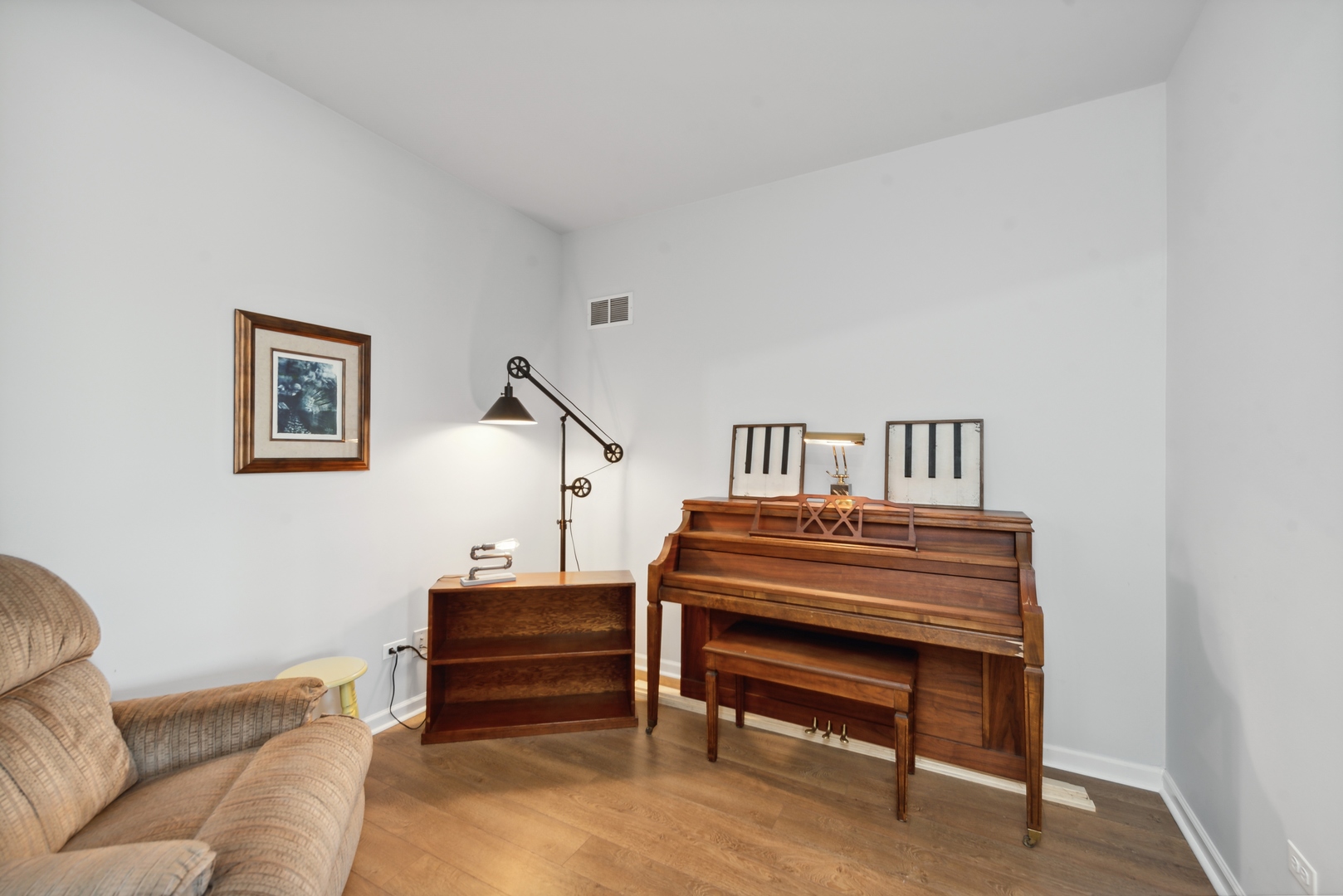 1355 Draper Road McHenry, IL 60050 - Photo 3 of 18 a bedroom with furniture and a piano