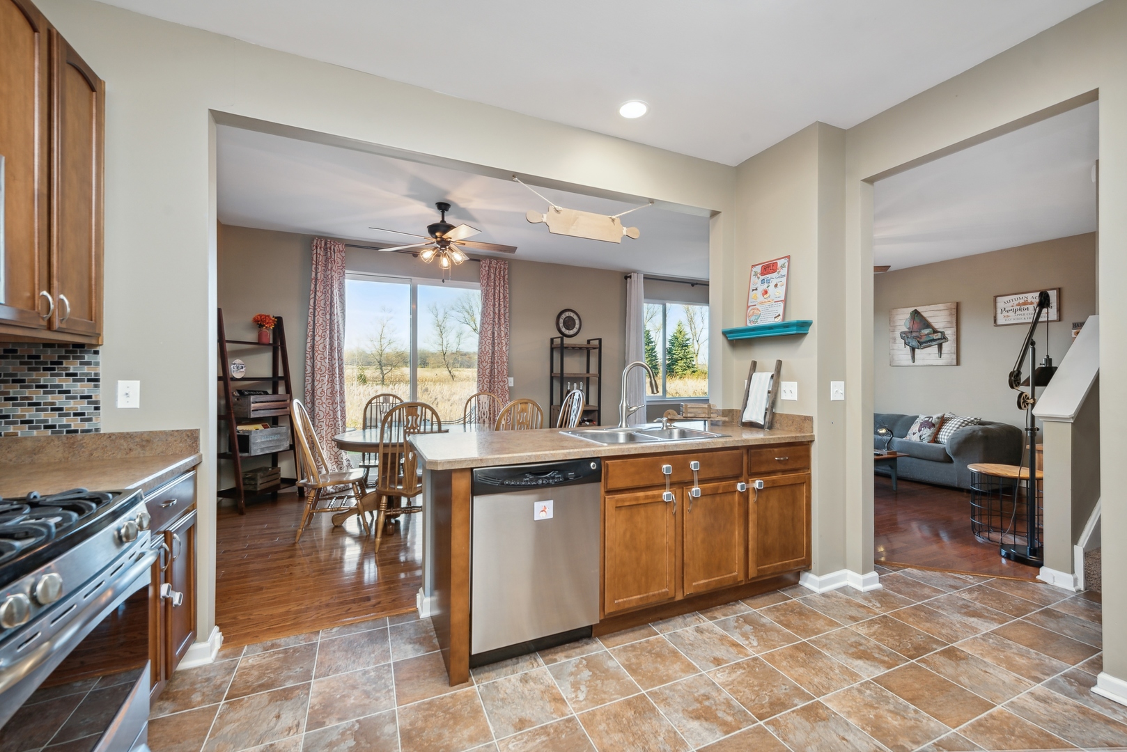 1355 Draper Road McHenry, IL 60050 - Photo 5 of 18 a large kitchen with a table and chairs in it